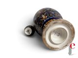 an image of a vase with a lid on a white surface