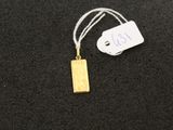a close up of a tag on a black surface with a tag attached to it