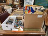 boxes of assorted items are sitting on a table in a room