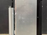 an image of a silver refrigerator with a black door