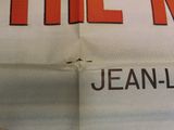 a newspaper that has a picture of a man on it