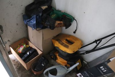 a box of tools and a box of tools in the corner of a room