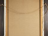 an old picture frame with a rope hanging from it ' s side