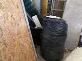 a picture of a pile of construction materials in the corner of a room