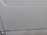 a white door with a black handle and a black handle