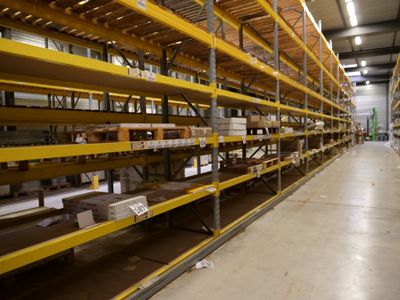 shelves in a warehouse filled with lots of boxes and boxes