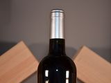 a bottle of wine that is sitting on a table