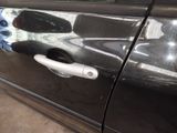 a close up of a door handle on a car