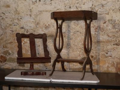 two chairs and a table with a mirror on top of it