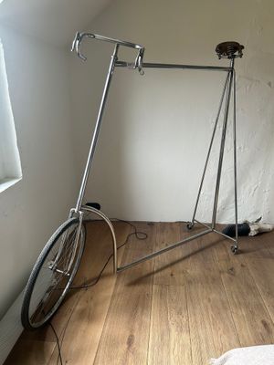 a bike that is sitting on a stand in the corner of a room