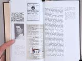 a person holding an open book in their hand