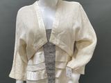 an image of a mannequin wearing a white dress and jacket