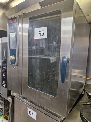 a picture of a commercial kitchen with stainless steel appliances