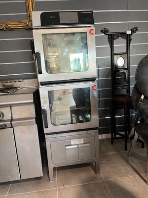 two ovens and a chair in a kitchen