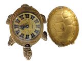 a gold turtle clock and a gold turtle watch