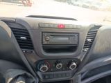 a dashboard of a car with a radio and other items in it