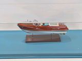a small model of a boat in a clear case