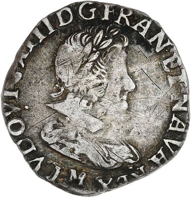 une pièce d'argent portant l'image d'un homme