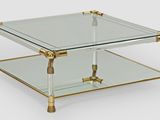 image d'une table basse en verre et laiton sur fond blanc