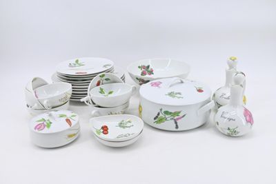 many plates and bowls that are sitting on a table