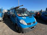 a blue van that is parked in a parking lot