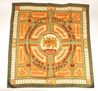 an image of a green and gold scarf with a picture of a lion