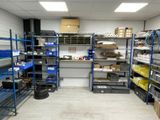 a room filled with lots of shelves and bins