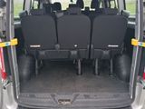 four seats in the back of a small van