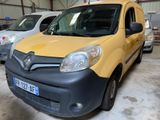 yellow and black van parked in a garage next to other cars