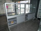 a glass display case in the middle of a room