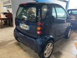 a small car that is parked in a garage