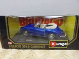 blue toy car in box on wooden table with white background