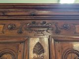 a close up of a wooden door with carvings on it