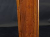 an old wooden cabinet with a door on top of it
