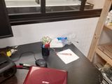 a desk with a laptop and a monitor on it