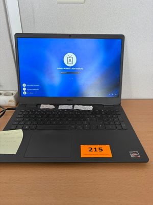 a laptop that is sitting on a desk with a price tag on it