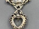 an image of a pendant with a stone in the middle of it
