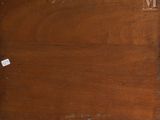 a piece of wood that has been scratched off and is sitting on the floor