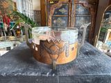 a glass bowl on a table in a room