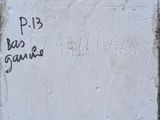 a sign on the wall that says p 13 bad santa