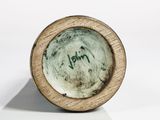 a close up of a small bowl with writing on it