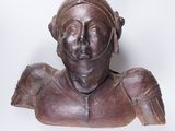 an old wooden bust of a woman with a helmet on her head