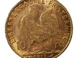 Gros plan sur une pièce d'or ornée d'un coq