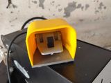 a small yellow object on top of a black table