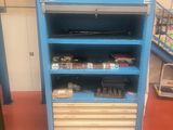 a blue shelf with a lot of items on it