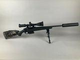 a rifle on a white background with a rifle scope