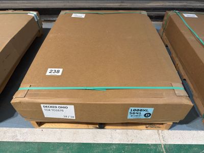 several boxes of cardboard sitting on top of a pallet in a warehouse