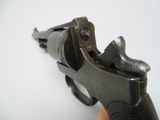 a small gun that is being held up by someone