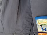 a close up of a jacket with a tag attached to it