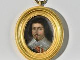 une photo d'un portrait miniature représentant un homme, dans un cadre doré